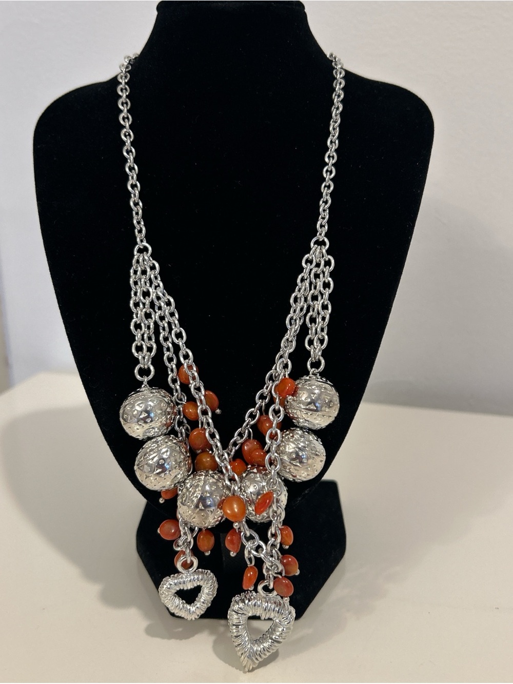 Silver-Tone Necklace with Orange Beads and Heart Pendants